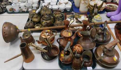 Copper, brass and metal wares, including kettles, small jugs, water jugs, two angelic wall...