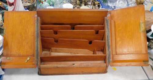 A correspondence box, two doors opening to reveal letter racks, faux drawer below.