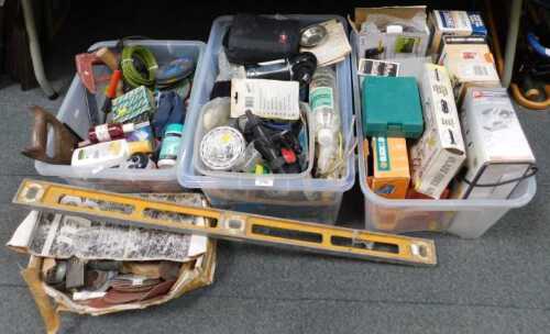 Tools and accessories, including spirit levels, hinges, paintbrushes, sanding discs, a saw, a...