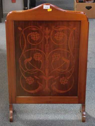 An inlaid fire screen.