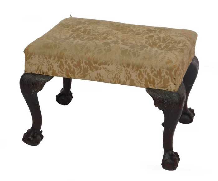 A late 19thC stool in George II style, having a damask-covered rectangular seat, supported on...