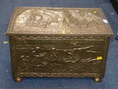 A brass-bound log bin having an embossed cover and a marine scene, 31cm high, 51cm wide, 33cm deep.