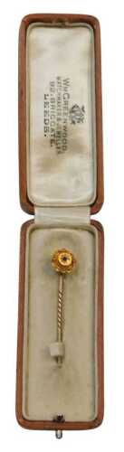 A Victorian stick pin, with a circular stick pin head, centred by sapphire, in claw setting,...