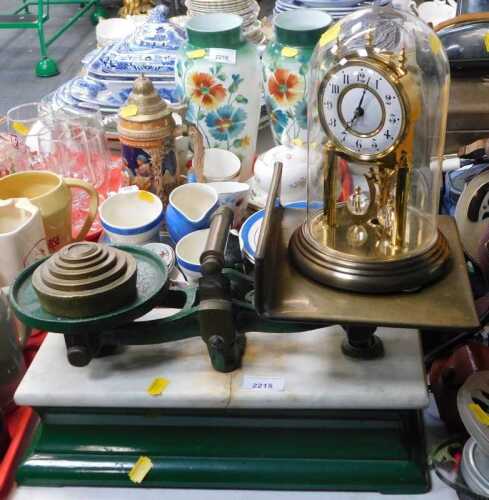An anniversary clock, and a set of cast iron base scales.