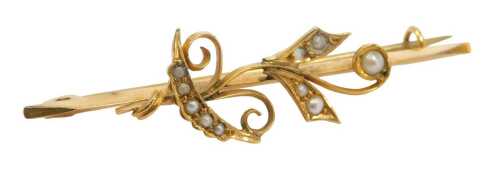 A Victorian seed pearl set bar brooch, in a floral and scrolling leaf design, set with seed...