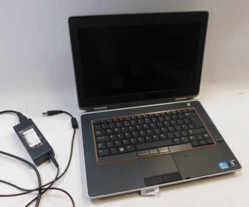 A DELL Latitude Core 15 laptop, lacking a hard drive. (AF)