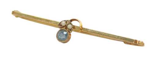 An Edwardian aquamarine and seed pearl bar brooch, in a leaf and flower design, yellow metal...
