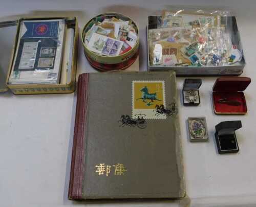 Costume jewellery and philately, including brooches, earrings, a tie clip, etc, postally used...