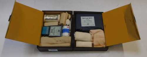 A vintage first aid box, in wooden case.