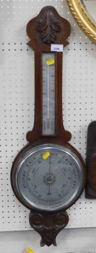 A banjo barometer, with temperature gauge.