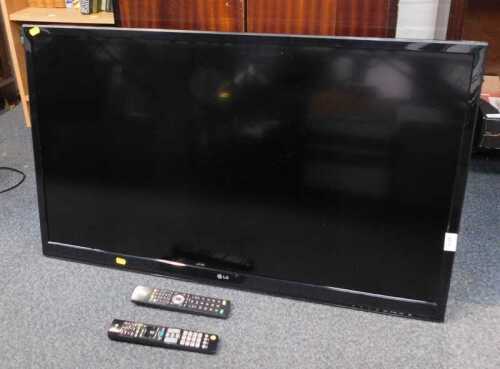 An LG 42" flat screen TV, with two remotes, model number 42L8575T-ZD.