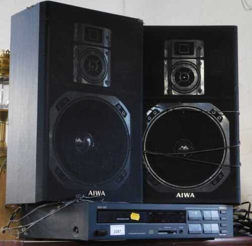A Nesco compact disc player and speakers, integrated remote-controlled digital audio compact...
