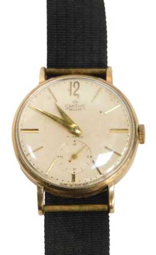 A Smiths Deluxe 9ct gold cased gent's wristwatch, with a cream batoned dial, with date aperture,...