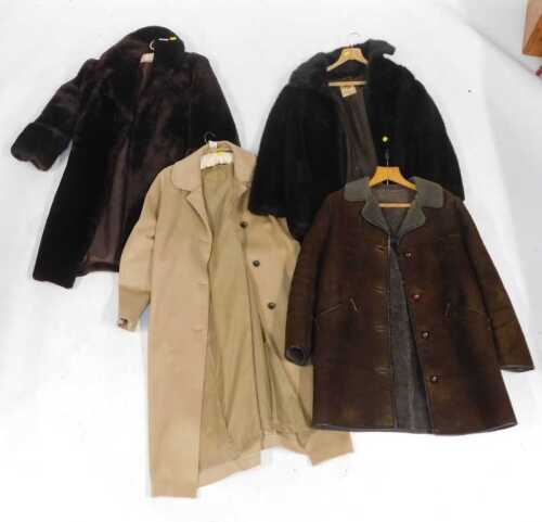 Two lady's fur coats, a sheepskin coat, and a woollen overcoat.