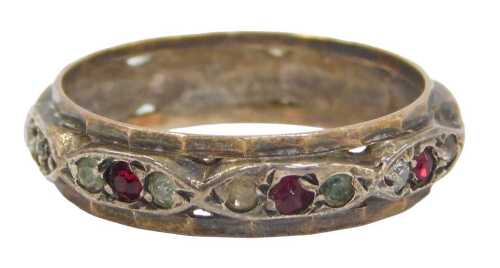 A dress ring, with red and white paste stones, on a raised design, yellow metal, marked 9ct &...