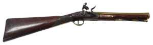 A late 18thC/early 19thC flintlock blunderbuss, with brass flared barrel, trigger guard, steel...