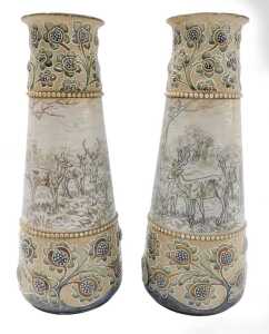 A pair of Royal Doulton Hannah Barlow vases, each decorated with woodland scenes with deer,...