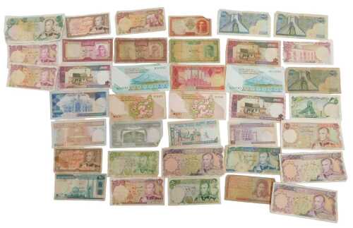 A collection of various Iranian bank notes, The Shah period and the Revolutionary period bank...