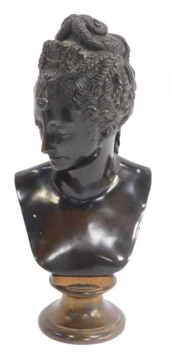After Jean Goujon. Diane de Poitiers, a brown patinated bronze bust, raised on a gilt socle base,...