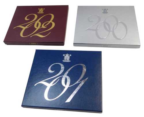 Three Royal Mint United Kingdom proof coin sets, for 2000, 2001, and 2002, boxed.
