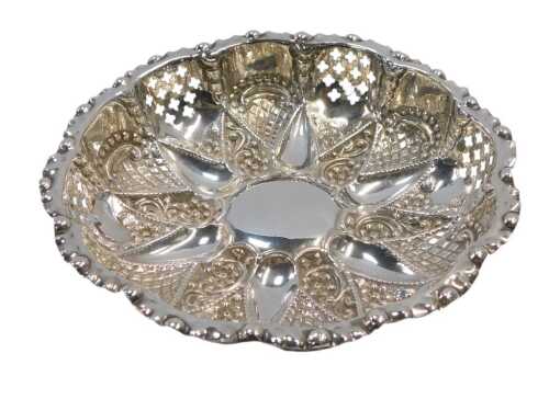 A Victorian silver pierced dish, with floral head and scroll embossed decoration, Murrle Bennet...