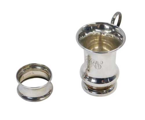 A George V silver beaker, of waisted form, initialled, raised on a circular foot, London 1914,...
