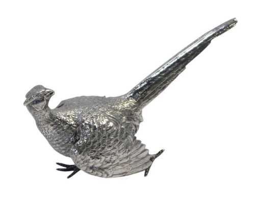 An Elizabeth II silver pheasant, modelled in a standing position with head turned, looking...