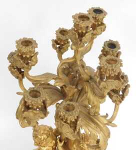 A 19thC French gilt metal five-branch candelabrum, of scrolling form with putti supports, the... - 2