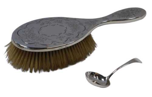 An Edward VII silver-backed hairbrush, engraved with butterflies, a spider and web, flowers, etc....