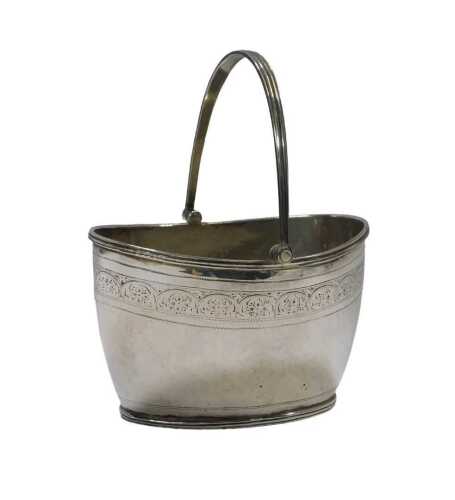 A Victorian silver swing-handled basket, decorated with a border of flower heads and scrolls,...