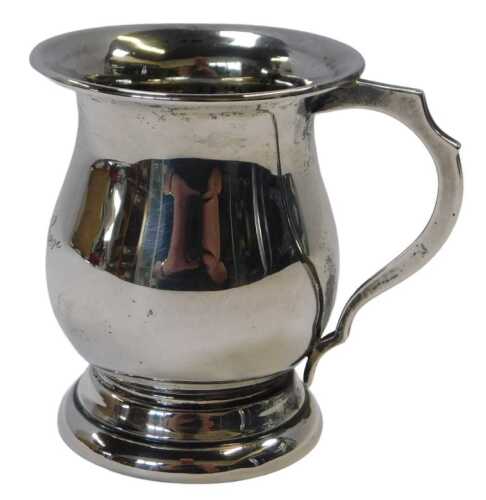 A George VI silver child's beaker, of baluster form, engraved Evelyn Lowther, raised on a...