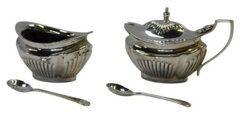 An Elizabeth II silver lidded mustard pot and open salt, each of semi fluted form, with blue...