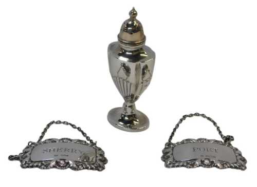 An Elizabeth II silver pepper pot, of semi fluted urn form, raised on an oval base, Birmingham...