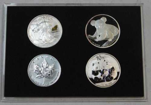 A World Famous silver coin set, comprising a 2009 US eagle one dollar, 2009 Australia koala one...