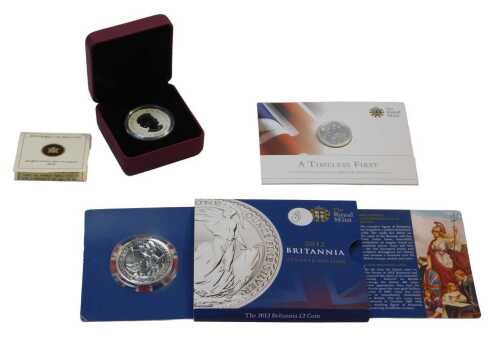 Two Royal Mint commemorative silver coins, comprising a Timeless First George and the Dragon...