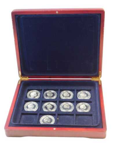Nine silver commemorative coins, to include a ten dollar Henry VII coin, a Queen Victoria crown,...