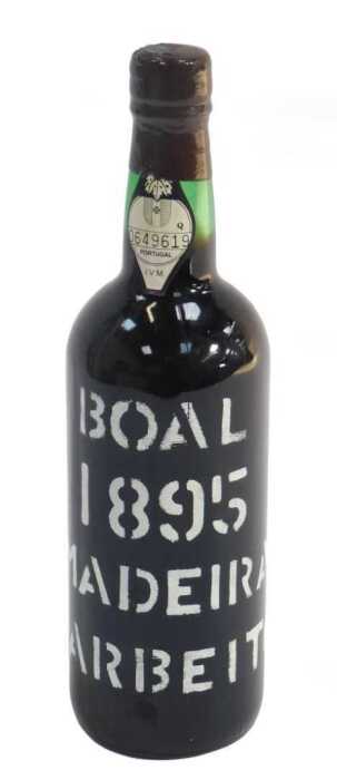 A bottle of Boal 1895 Barbeito Madeira, bearing paper label numbered 0649619, with partial wax...