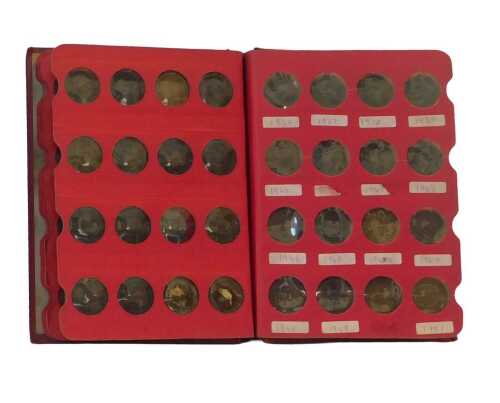 A coin library album containing pre-decimal coinage, to include part silver half crowns,...