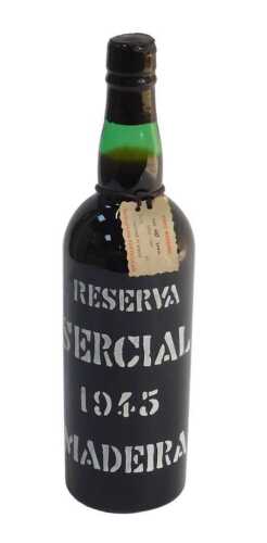 A bottle of Reserva Sercial 1945 Madeira, with partial wax seal.
