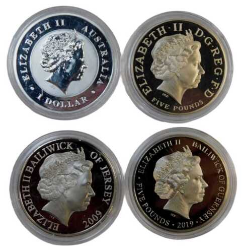 Three silver commemorative five-pound coins, including a Henry VIII commemorative, together with...
