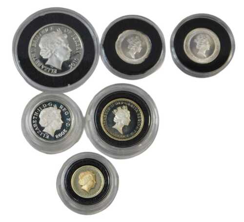 Six commemorative coins, comprising two 1/10 oz guineas, a Revolution to Restoration two-pound...