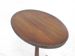 A George III wine table, with oval laburnum top with rosewood crossbanding, the reeded column... - 2