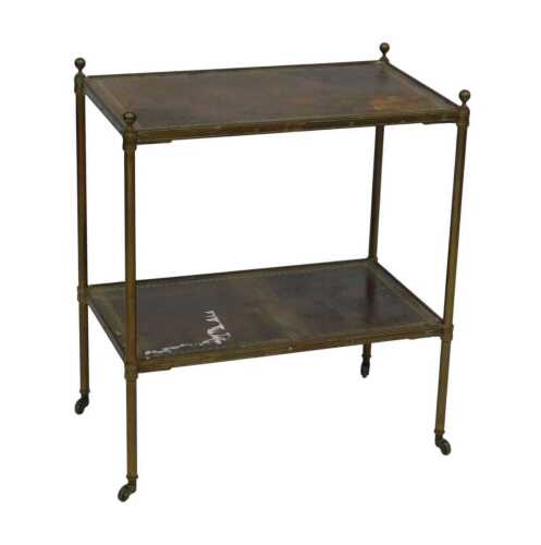 An Edwardian brass framed two tier occasional table on castors, having two rosewood shelves with...