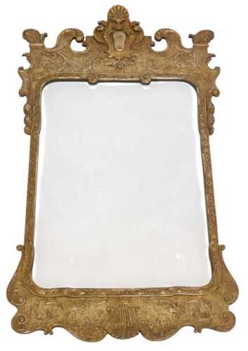 A late 19thC silvered pier glass in George II style, having a scroll and cartouche top and a...