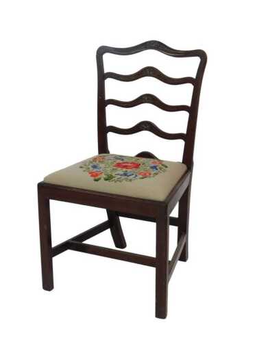 A George III mahogany ladder back chair, with a drop-in floral woolwork seat. Provenance: The St....