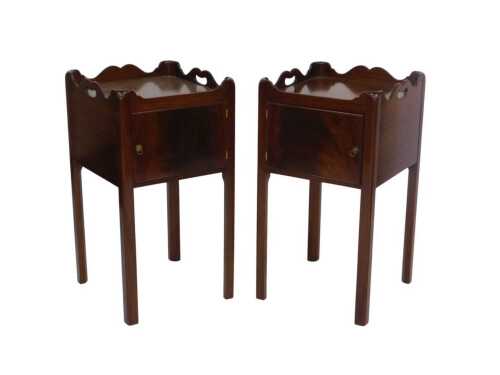 A pair of George III-style mahogany tray-top night cabinets, each with a single door and moulded...