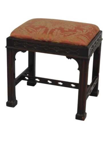 A late 19thC mahogany stool, in George III Gothic style, with moulded legs, blind-fret frieze...