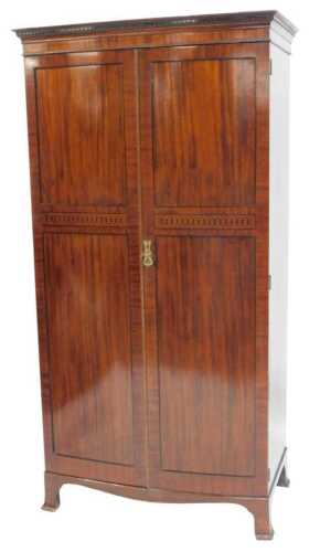 An early 20thC mahogany bowfront double wardrobe by Wylie & Lochead Ltd of Glasgow, having a...