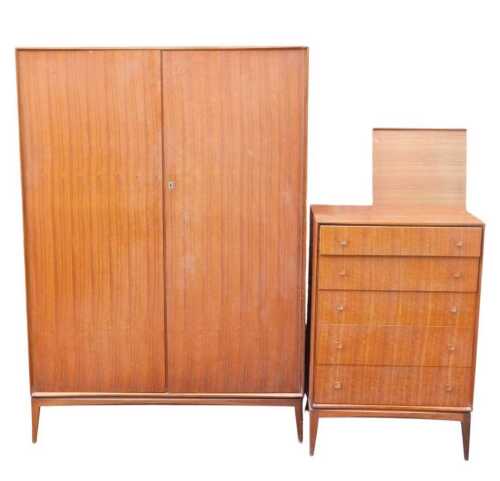 A Mackintosh Furniture bedroom suite, comprising a fitted double wardrobe, a chest of five...