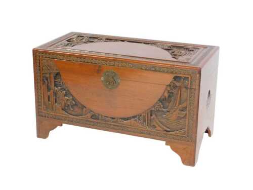An early 20thC carved camphorwood blanket chest, decorated with ivy leaves, ships and landscapes,...